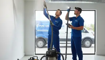 Technician cleaning air ducts for improved airflow and air quality in Houston, TX home